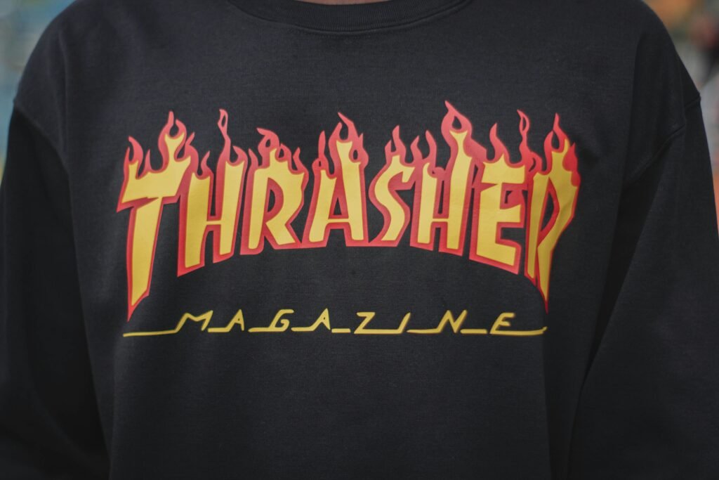 Close-up of a Thrasher Magazine hoodie, showcasing the iconic flames logo in vibrant detail.